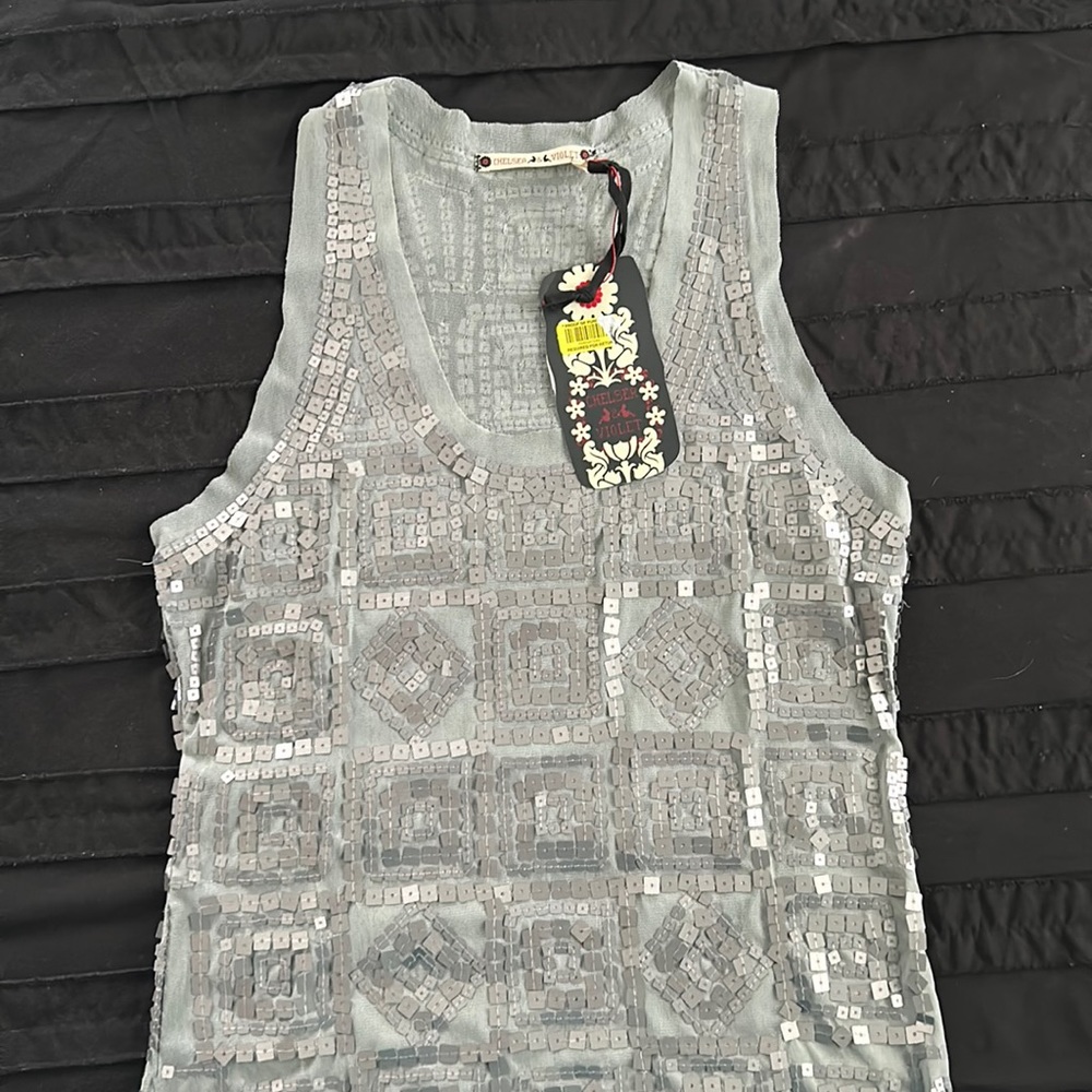 Smoke color beautiful large, sequin tank top.